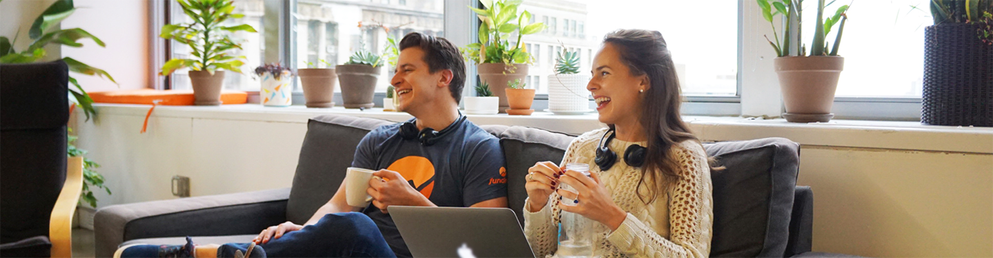 Employees at Fundera Drinking and Laughing